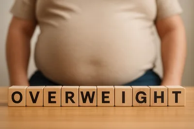 Overweight Person Standing Behind Wooden Blocks Spelling Overweight