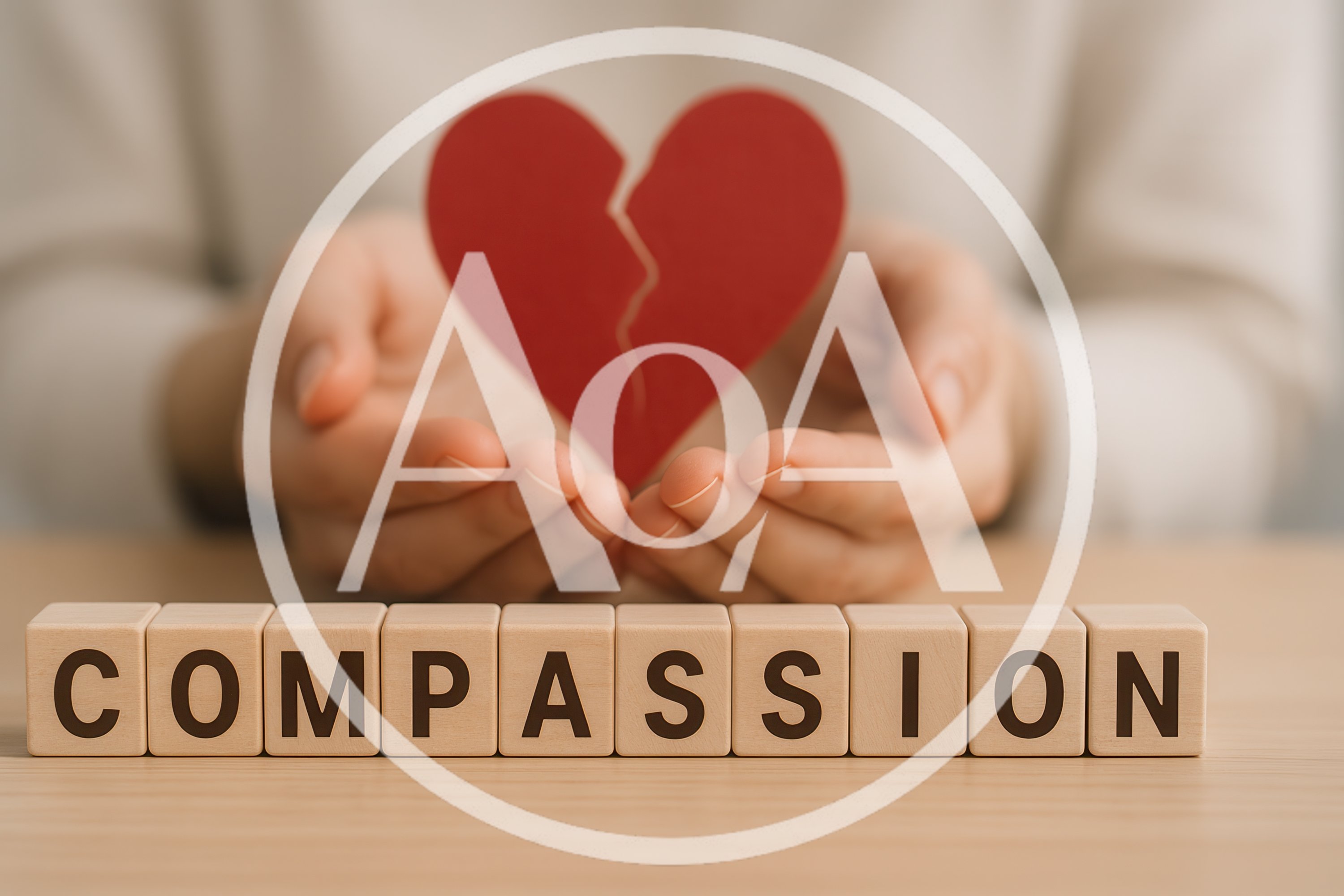 Hands Holding A Broken Heart Symbol With Compassion Blocks