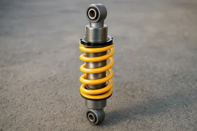 Yellow Coilover Shock Absorber Standing On Concrete