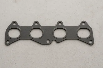 Automotive Exhaust Manifold Gasket on Textured Background