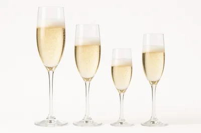 Four Champagne Flutes Filled With Sparkling Wine