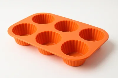 Orange Silicone Muffin Pan On White Background