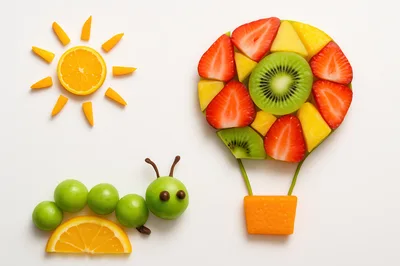 Creative Fruit Art Featuring A Caterpillar And Hot Air Balloon