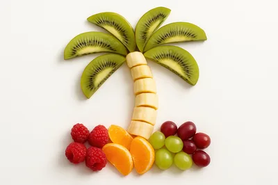 Creative Fruit Palm Tree Art on White Background