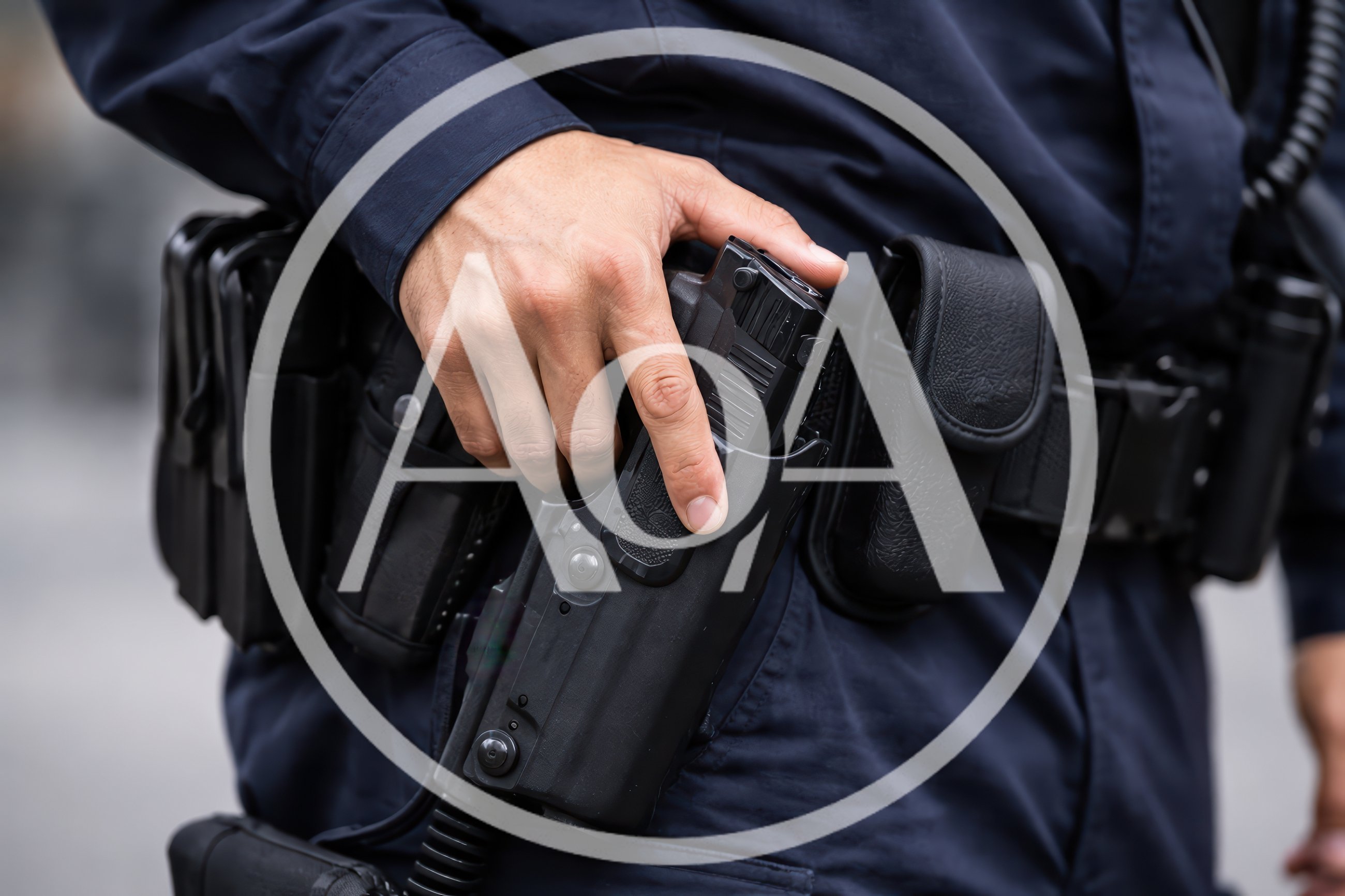 Police Officer Hand Resting On Duty Holster