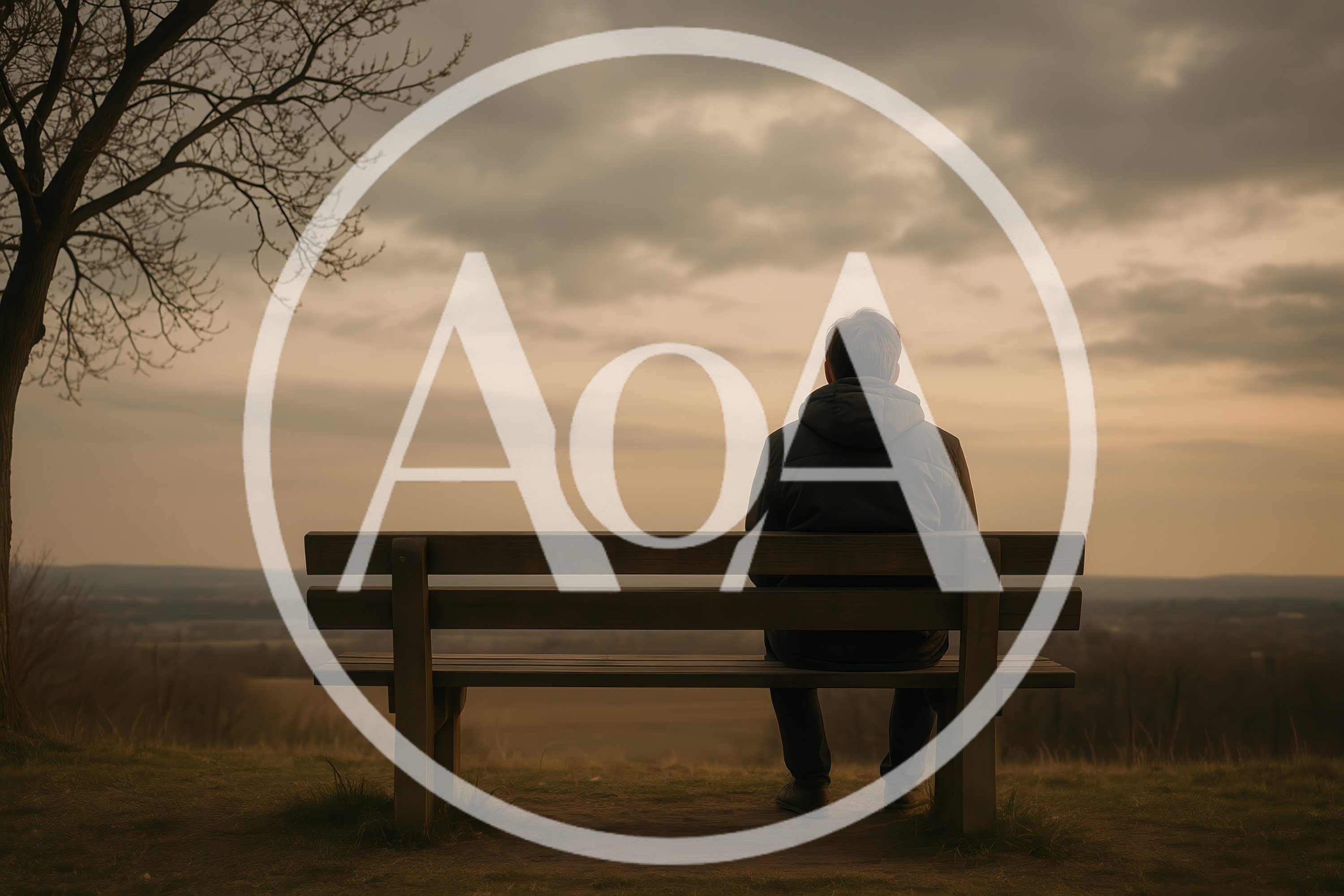 Man Sitting Alone On A Bench Overlooking A Landscape