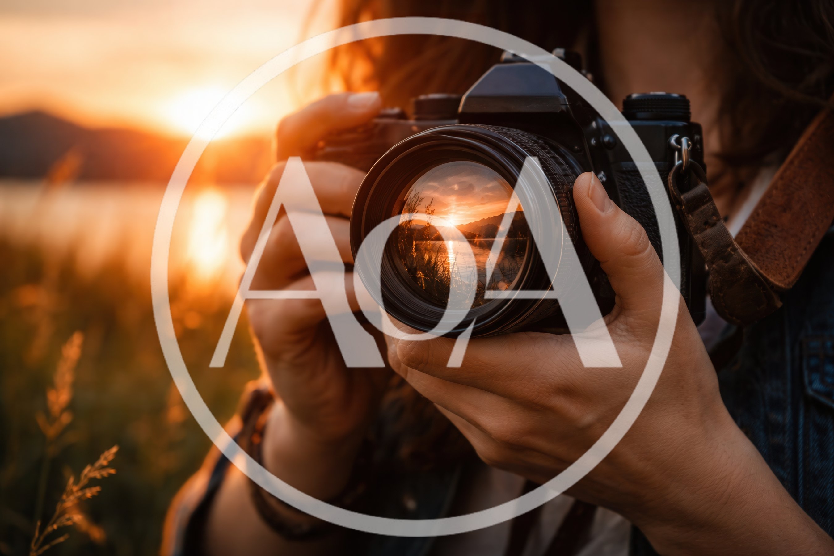 Photographer Holding Camera Capturing Sunset Over Lake