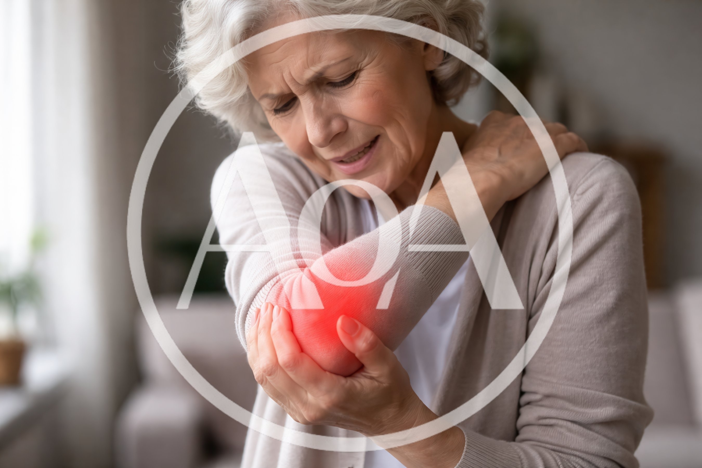 Senior Woman Suffering From Elbow Joint Pain