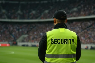 Security Guard Standing At A Professional Soccer Stadium