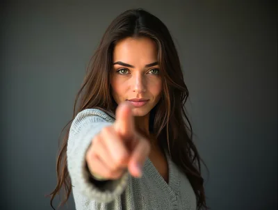 Young Woman Pointing Directly At The Camera