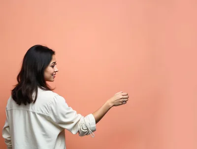 Young Woman Holding Invisible Object Against Peach Background