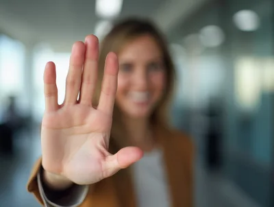 Businesswoman Holding Up Hand In Stop Gesture