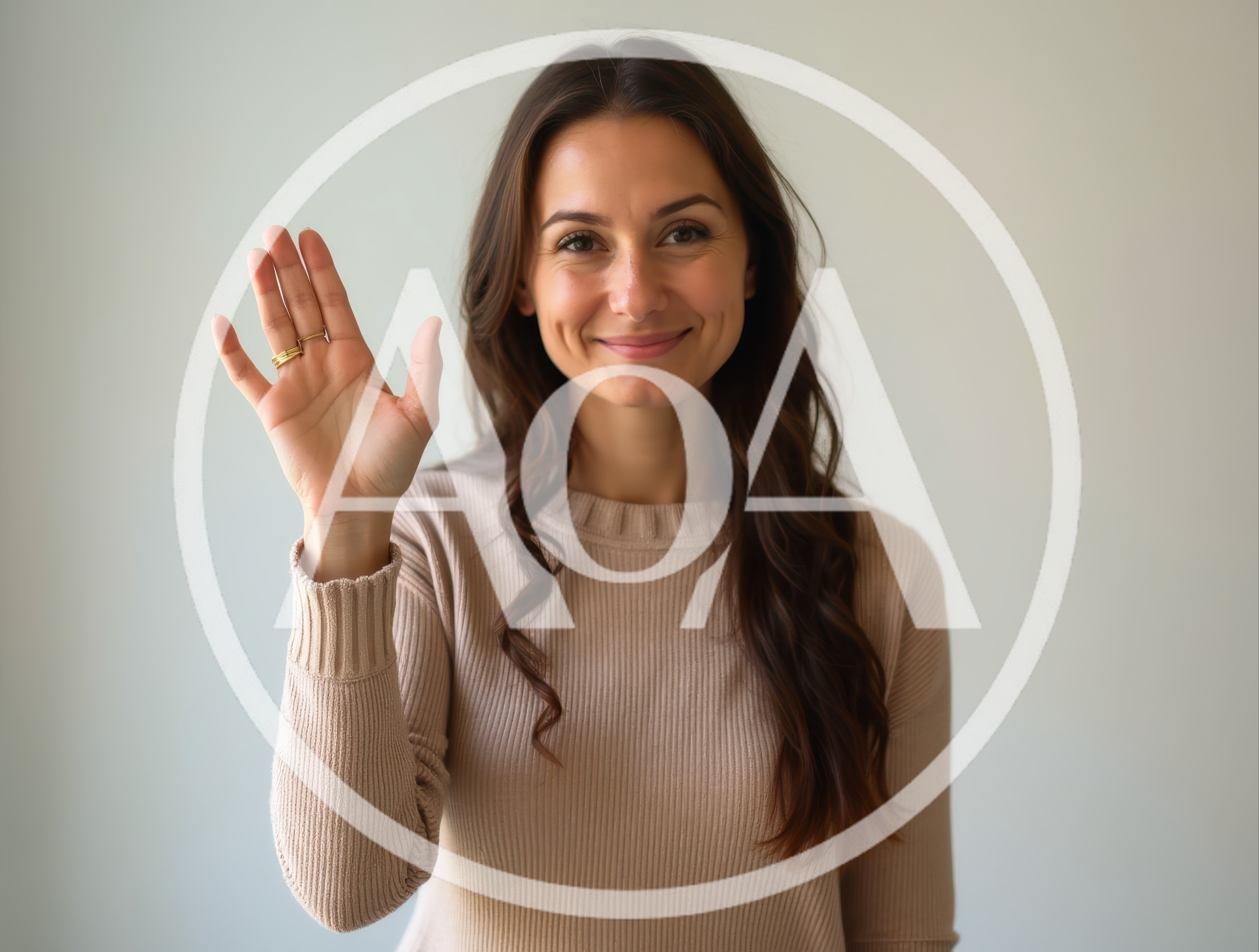 Young Woman Waving Hello Against A Neutral Background