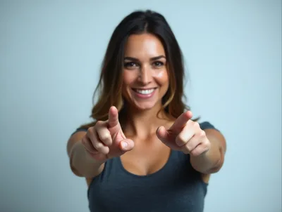 Smiling Woman Pointing Forward With Both Hands