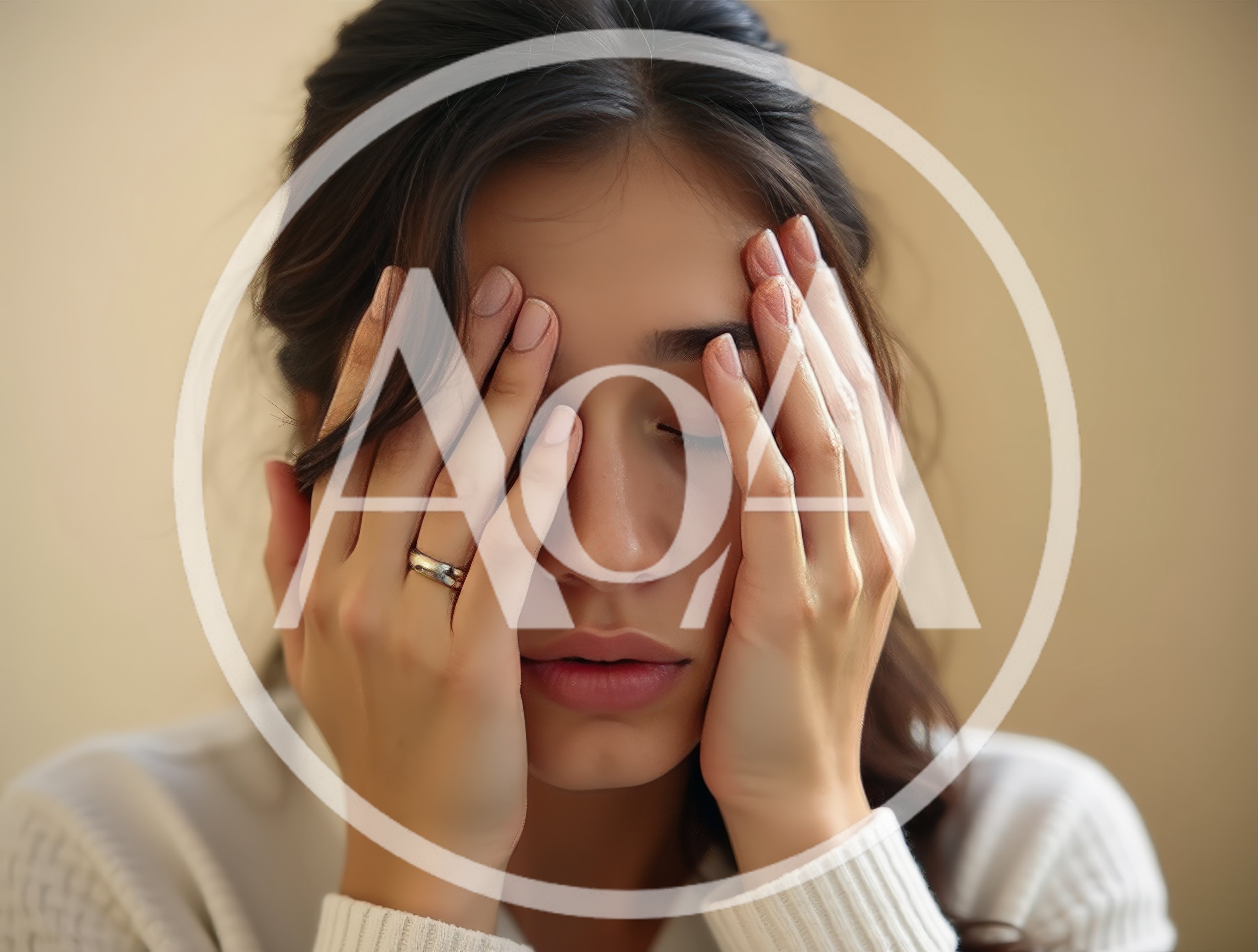 Stressed Young Woman Holding Her Head In Hands