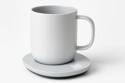 White Ceramic Mug On A Digital Warming Coaster