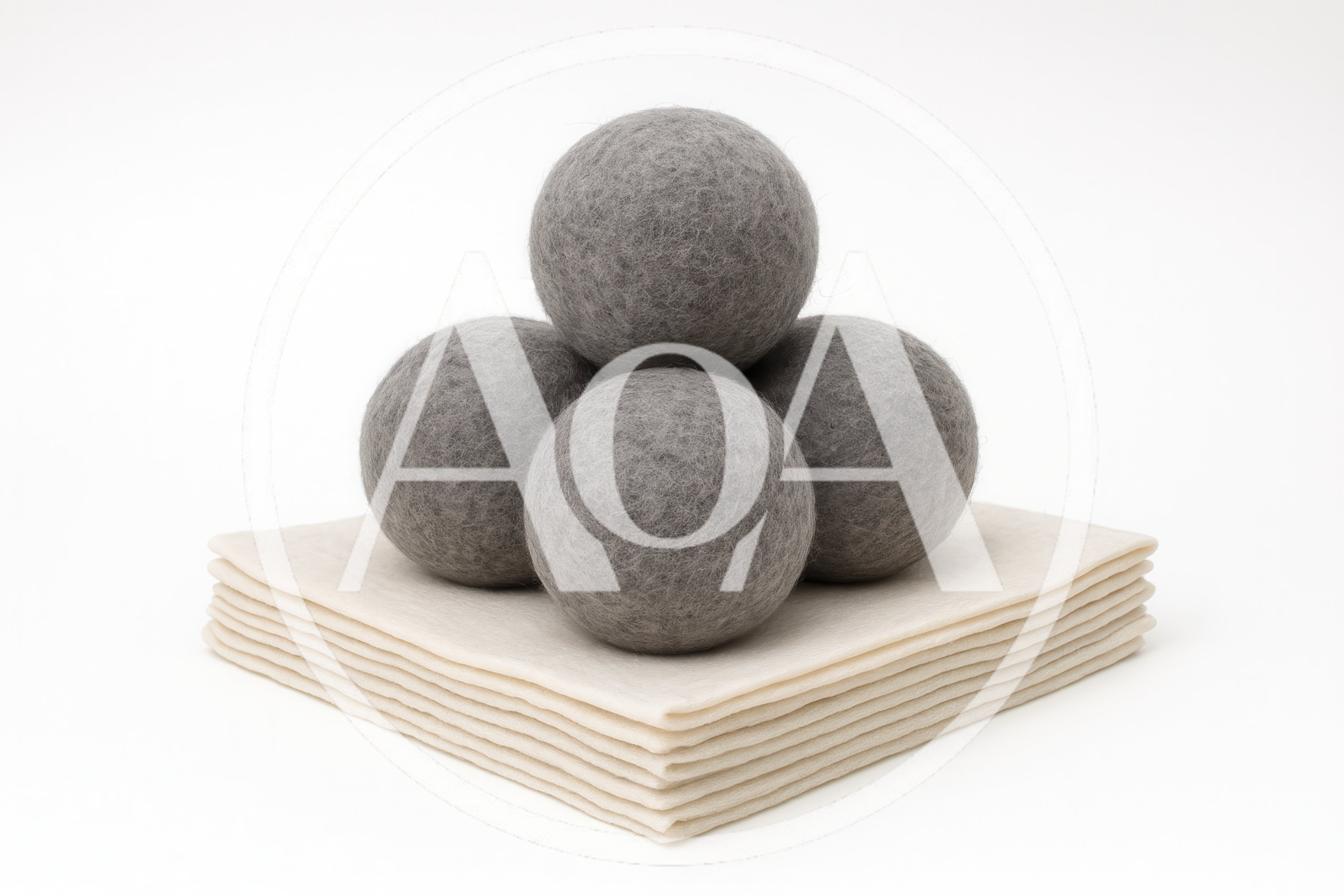 Grey Wool Dryer Balls On Stacked Felt Sheets
