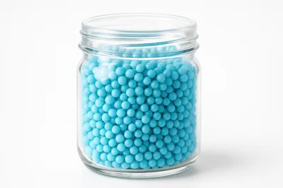 Glass Jar Filled With Small Blue Spheres