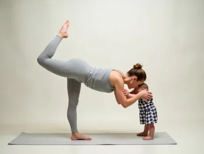 Mother Doing Yoga With Her Baby