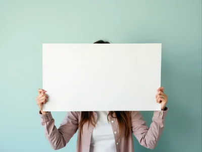Woman Holding Blank White Sign Against Blue Background