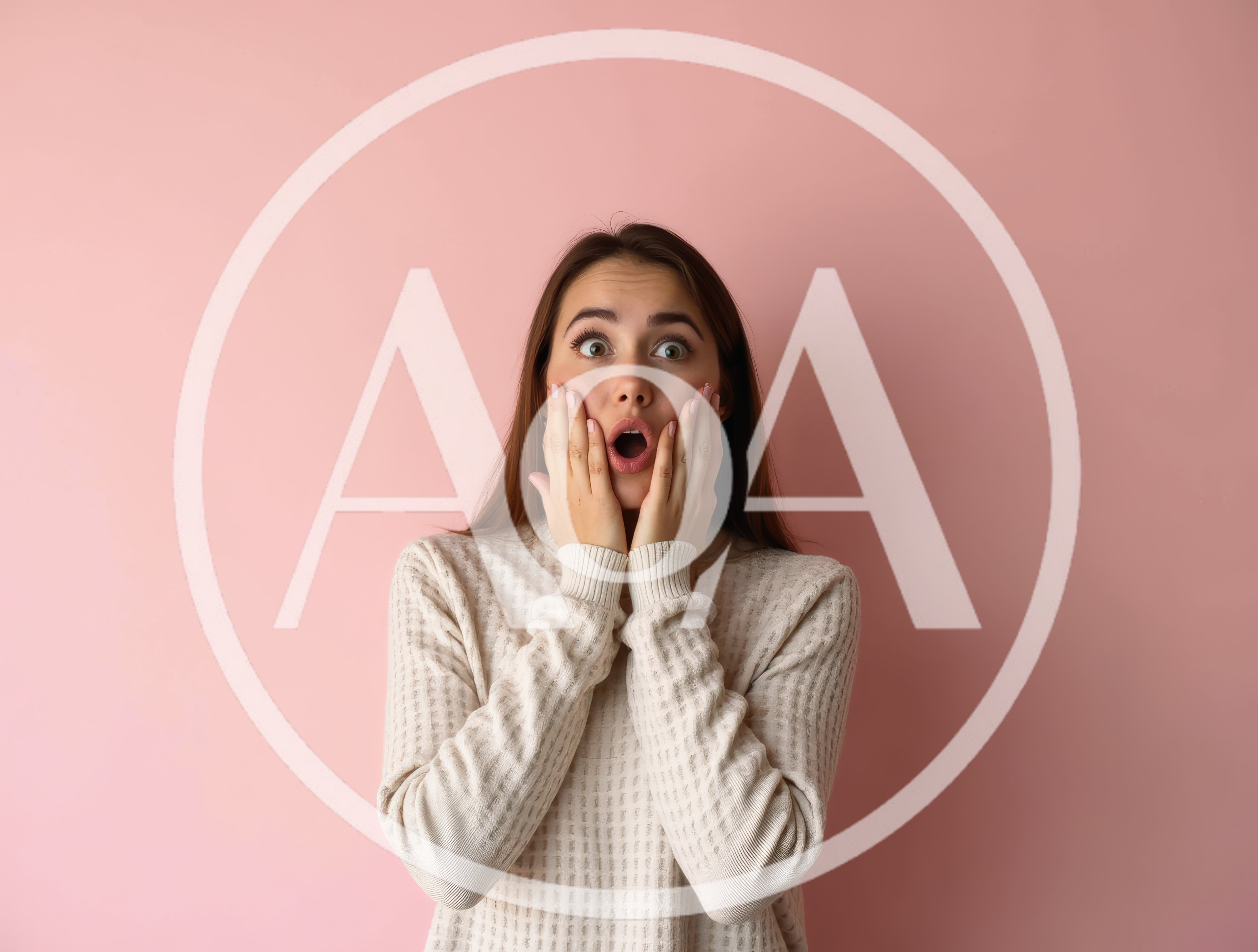 Surprised Young Woman With Hands On Cheeks