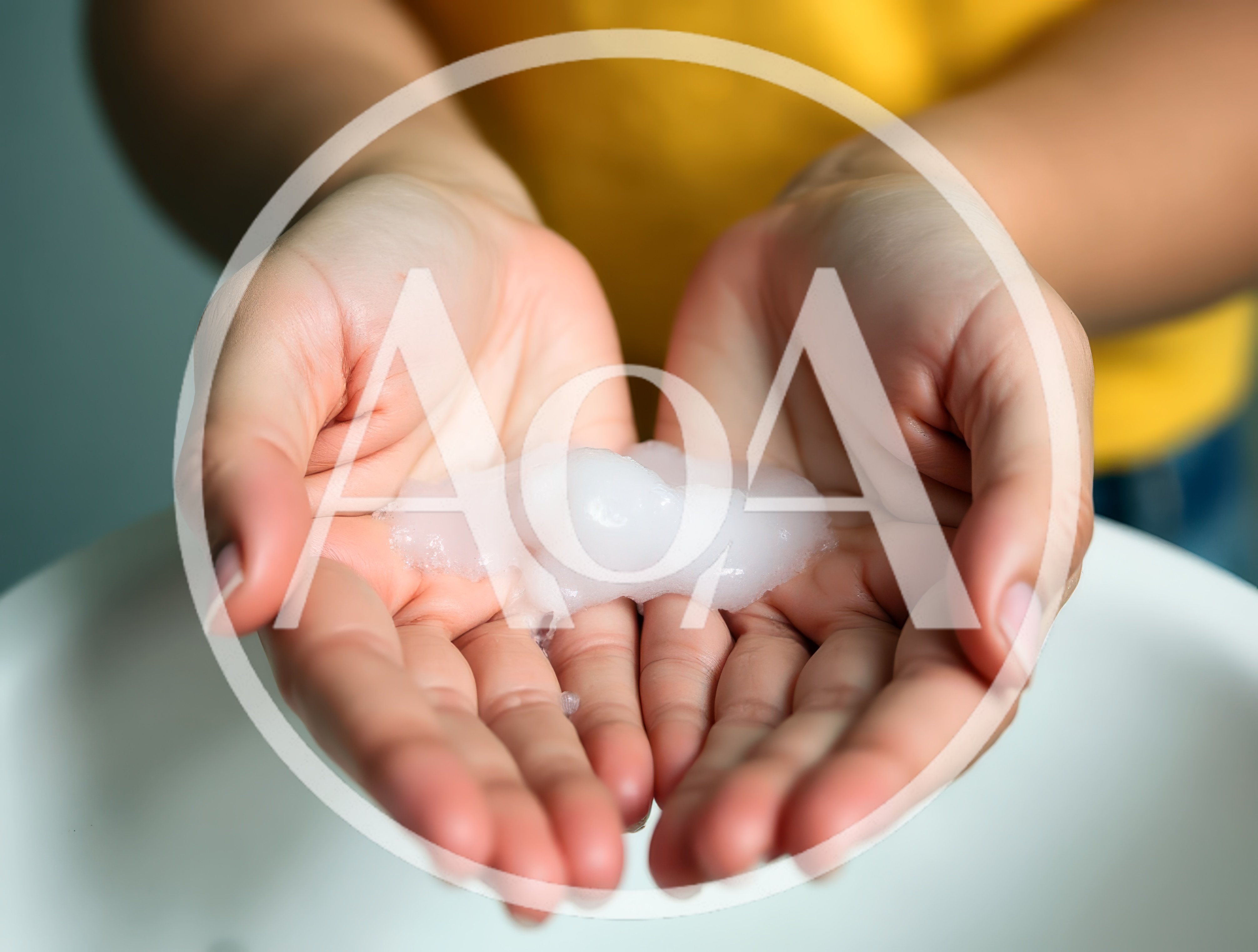 Person Holding White Soap Foam In Cupped Hands