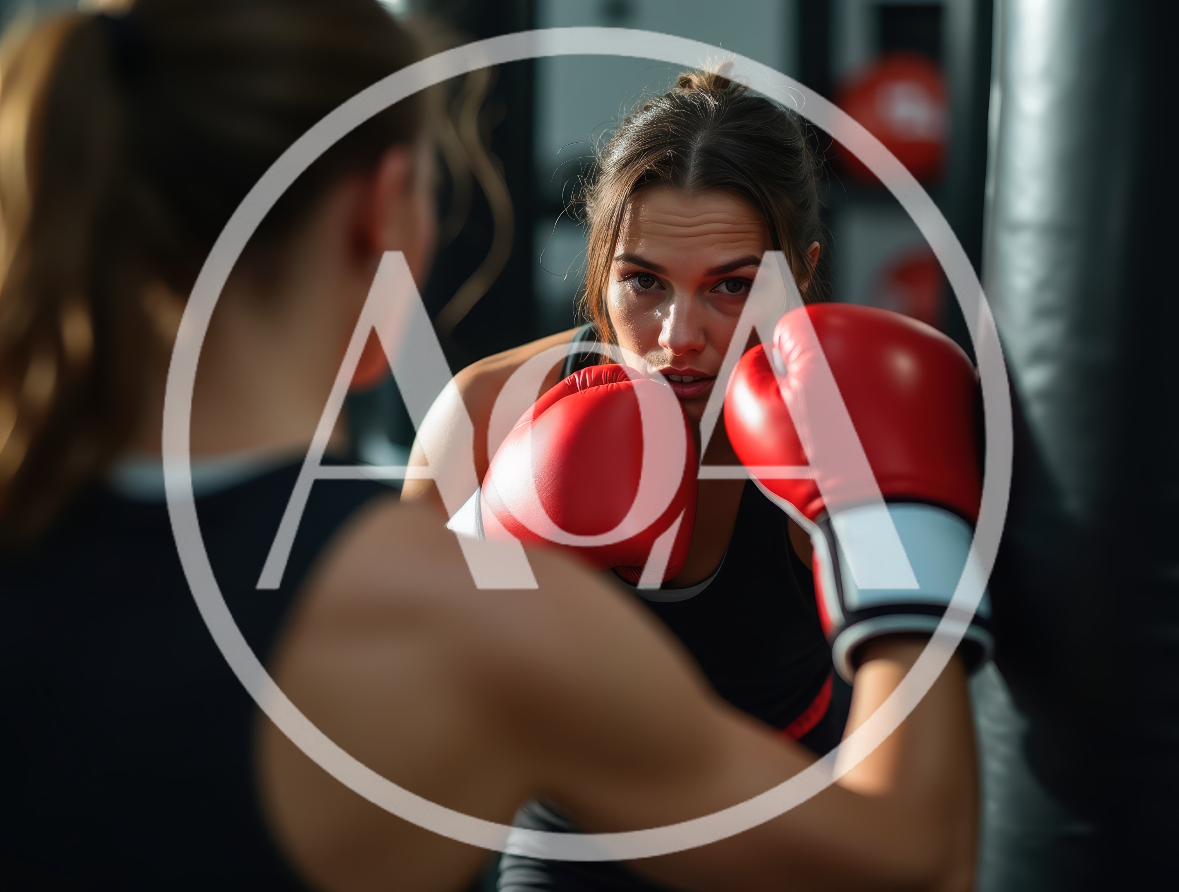 Female Boxer Training With A Punching Bag