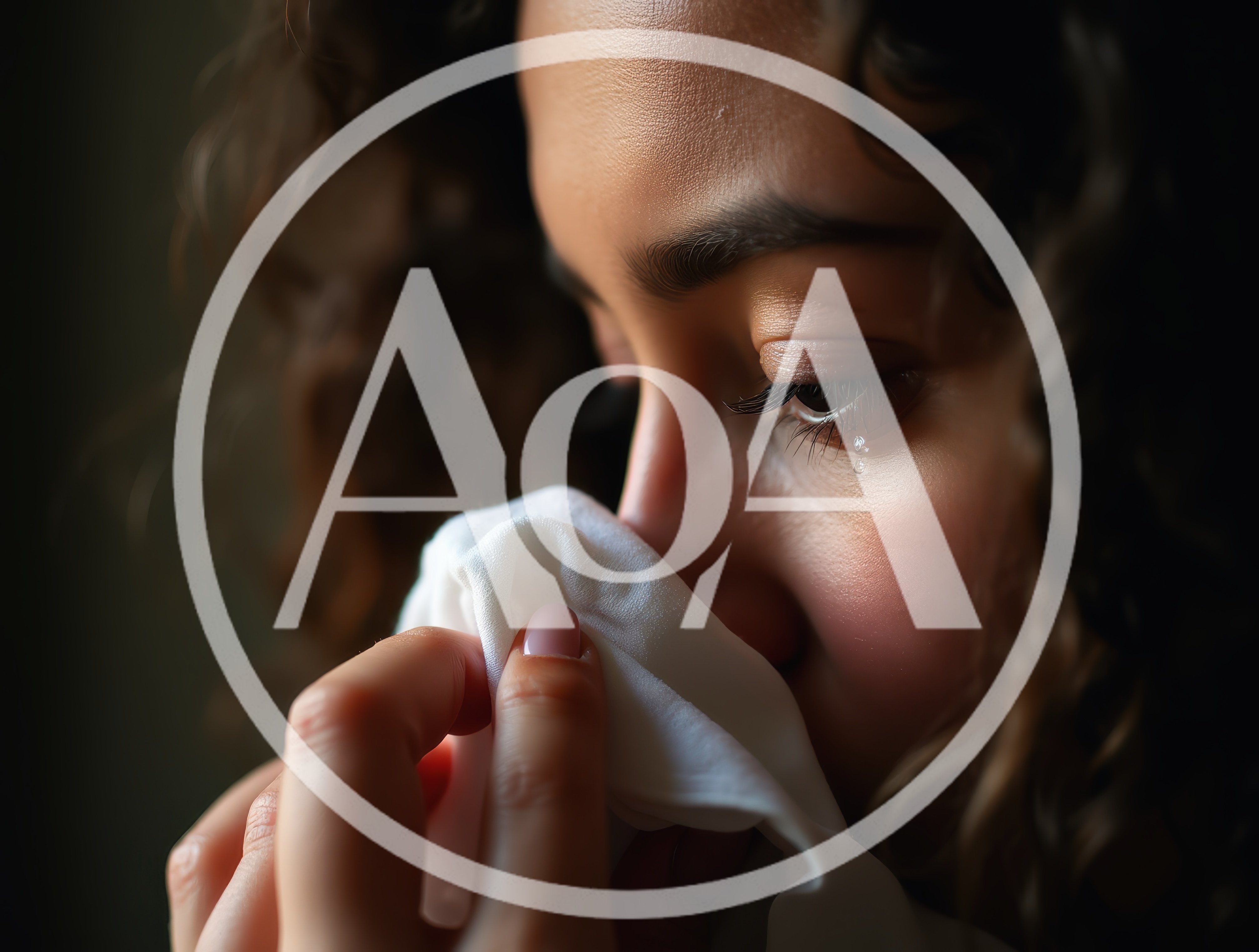 Close Up Of A Crying Woman Holding A Tissue