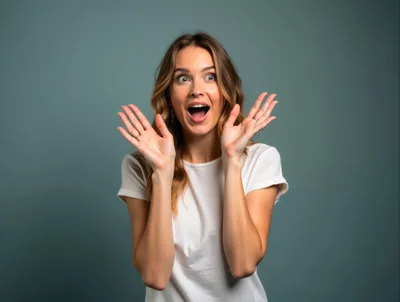 Surprised Young Woman With Hands Raised