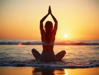 Woman Practicing Yoga In The Ocean At Sunset