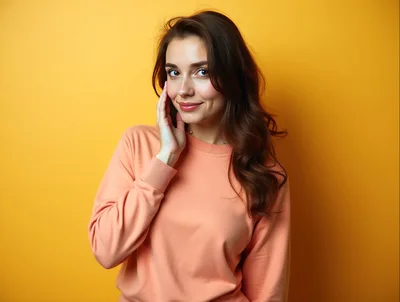 Young Woman Posing Against A Vibrant Yellow Background