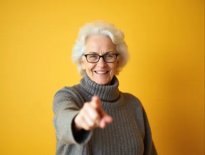 Senior Woman Pointing Directly At Camera