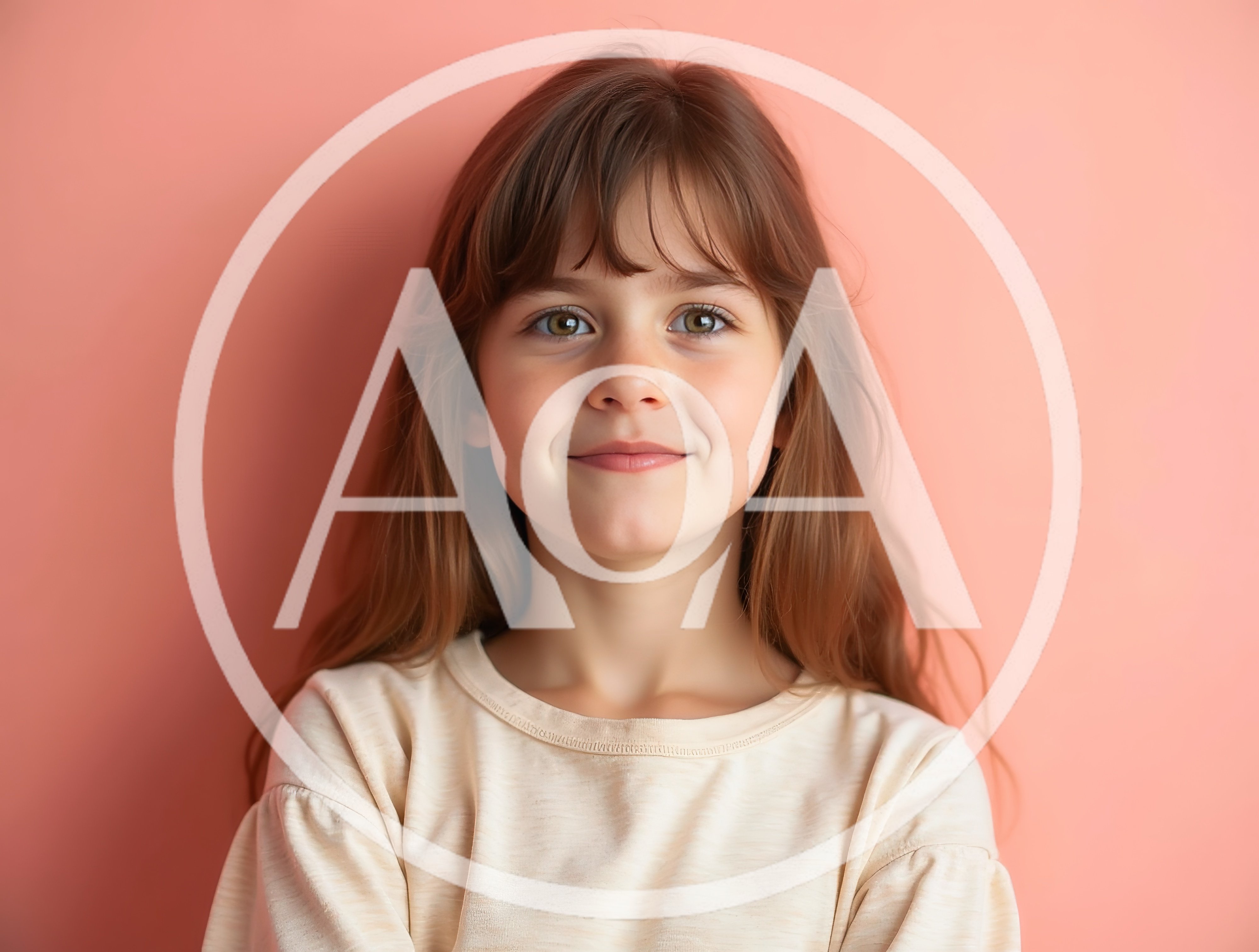Portrait Of A Young Girl Smiling Against A Pink Background
