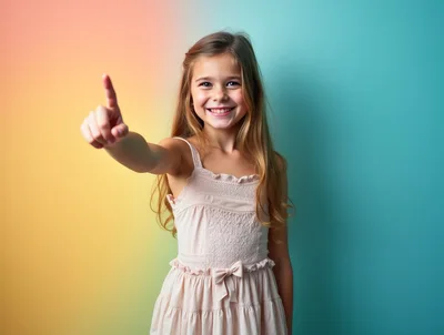 Young Girl Pointing Upwards Against A Colorful Gradient Background
