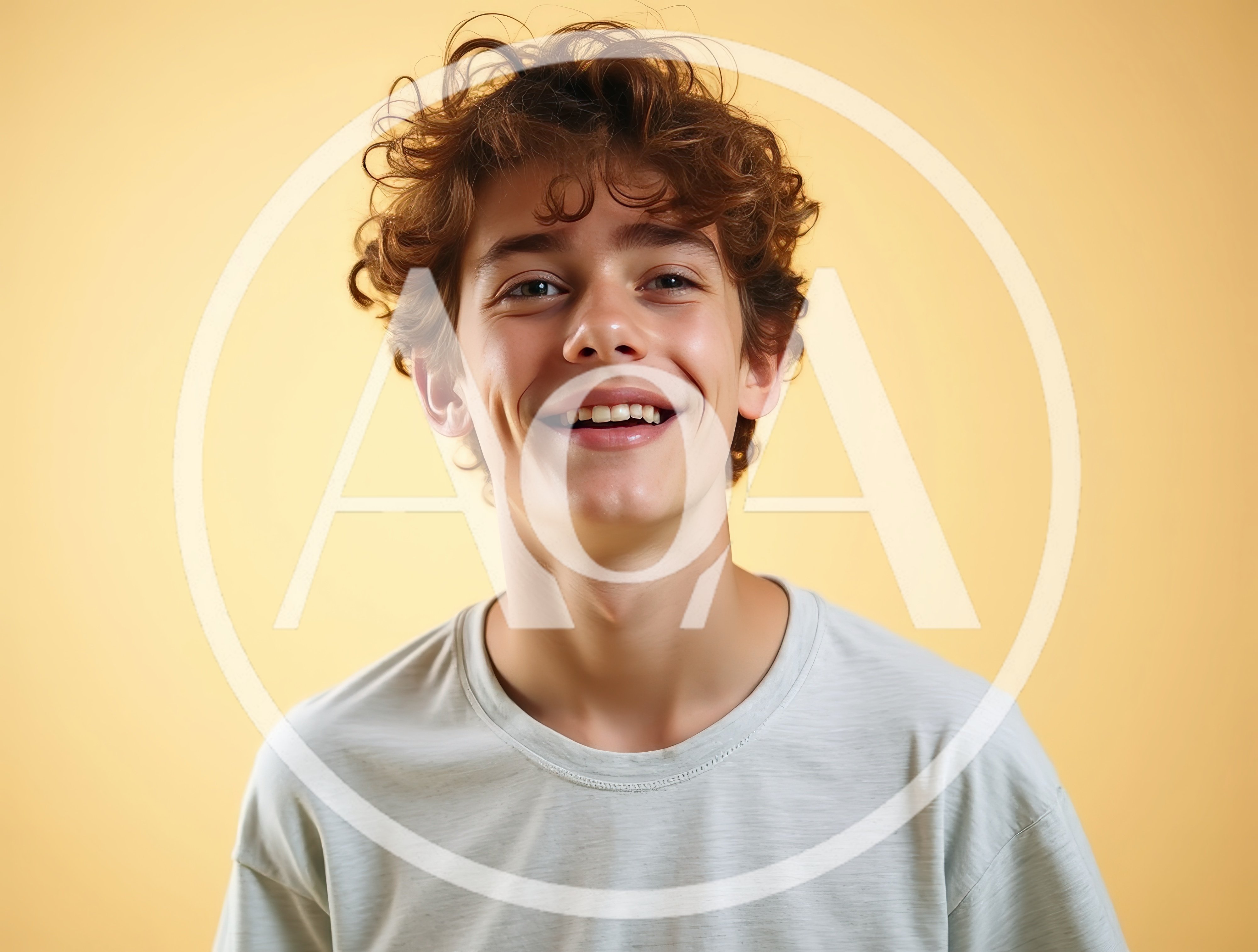 Portrait Of A Smiling Teenage Boy With Curly Hair