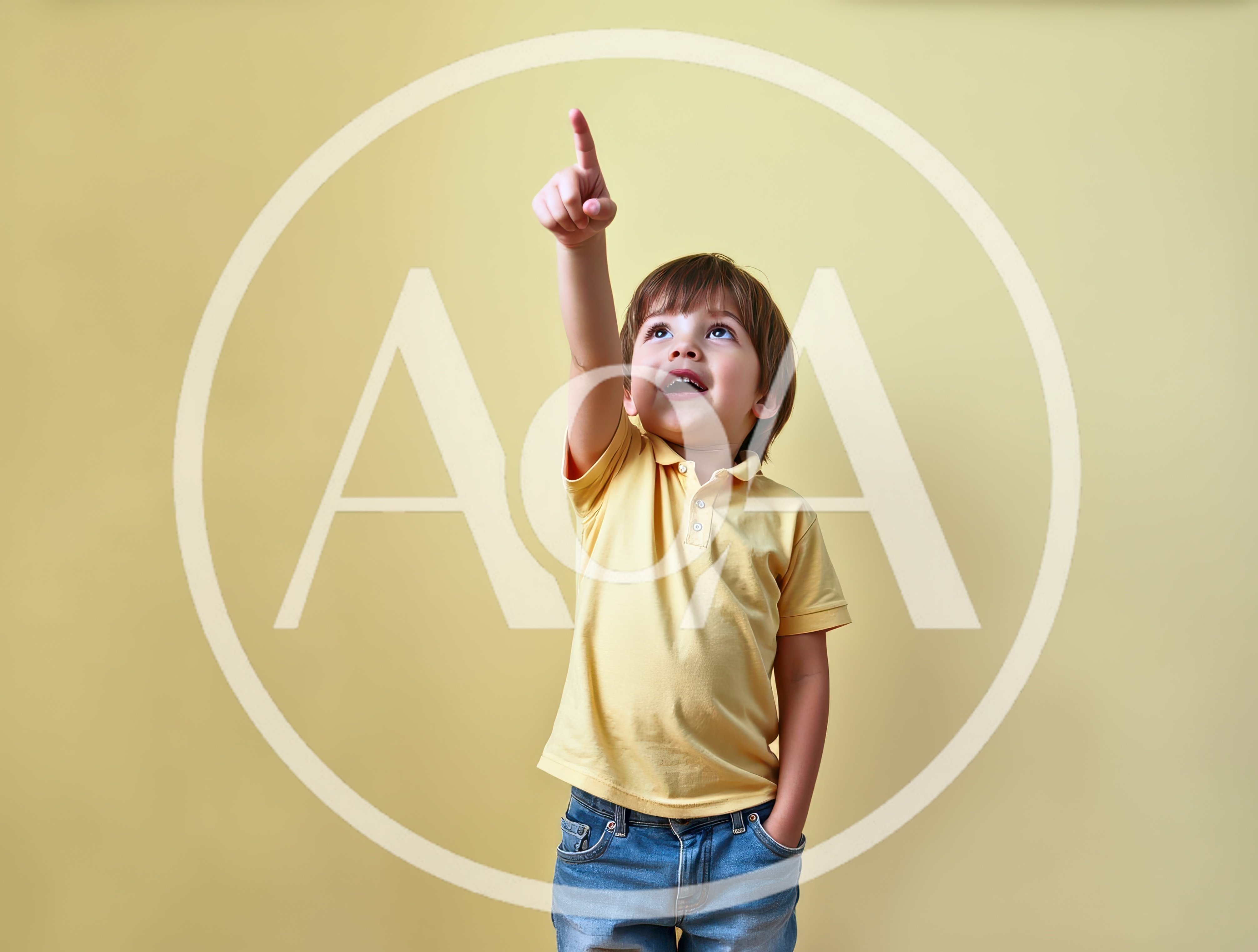 Young Boy Pointing Upwards Against Yellow Background