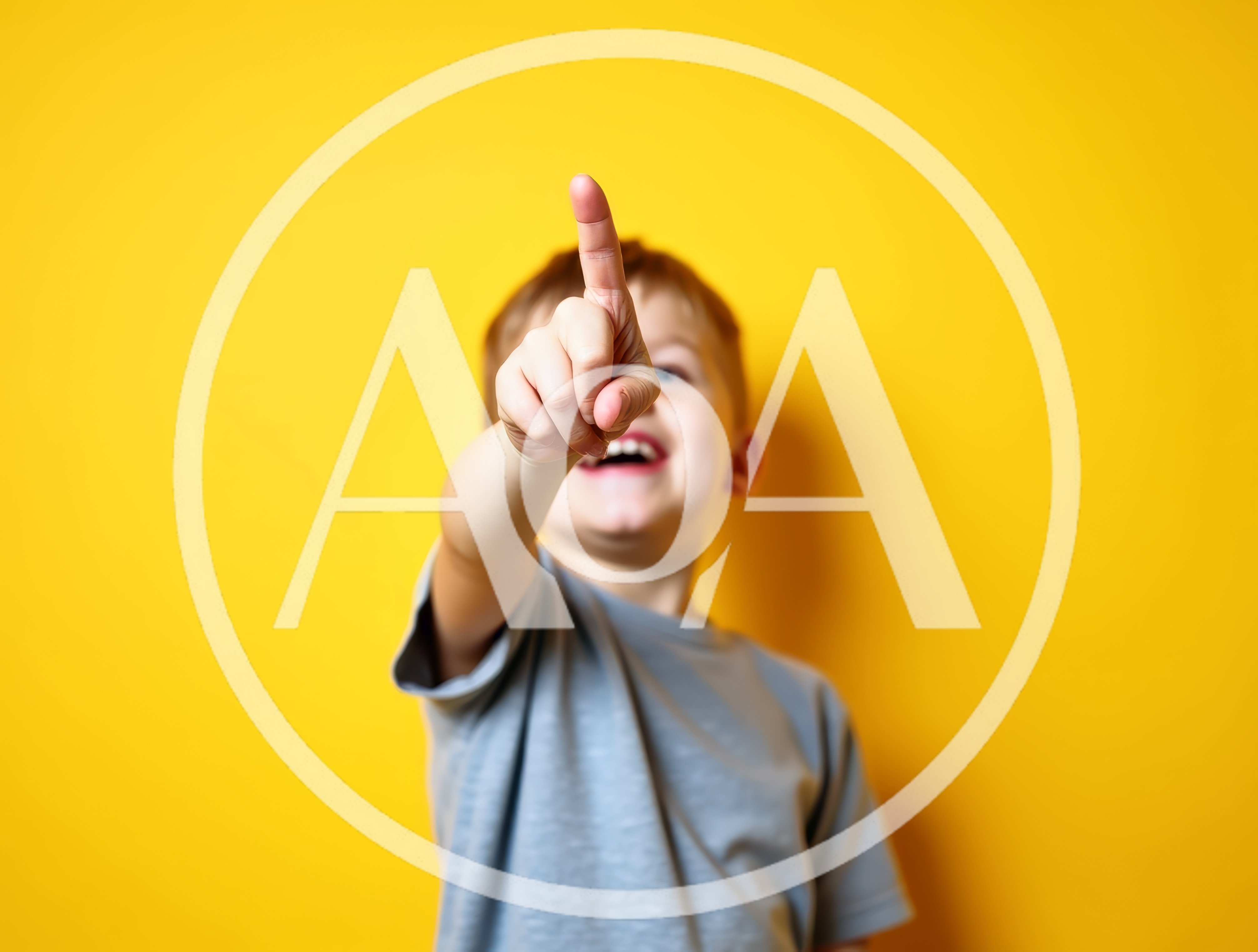 Happy Young Boy Pointing Finger At Camera