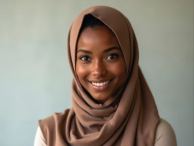 Portrait Of A Smiling Young Woman Wearing A Hijab