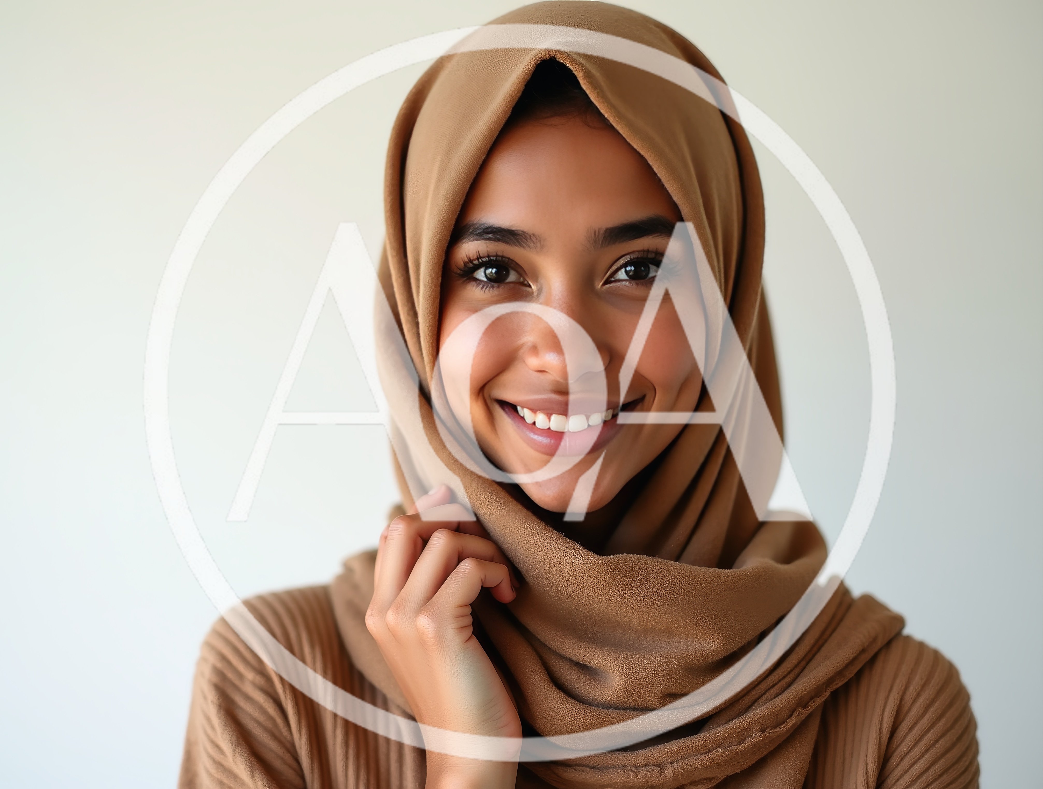 Smiling Young Woman Wearing A Tan Hijab