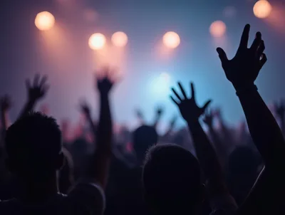 Concert Crowd With Raised Hands At Music Festival