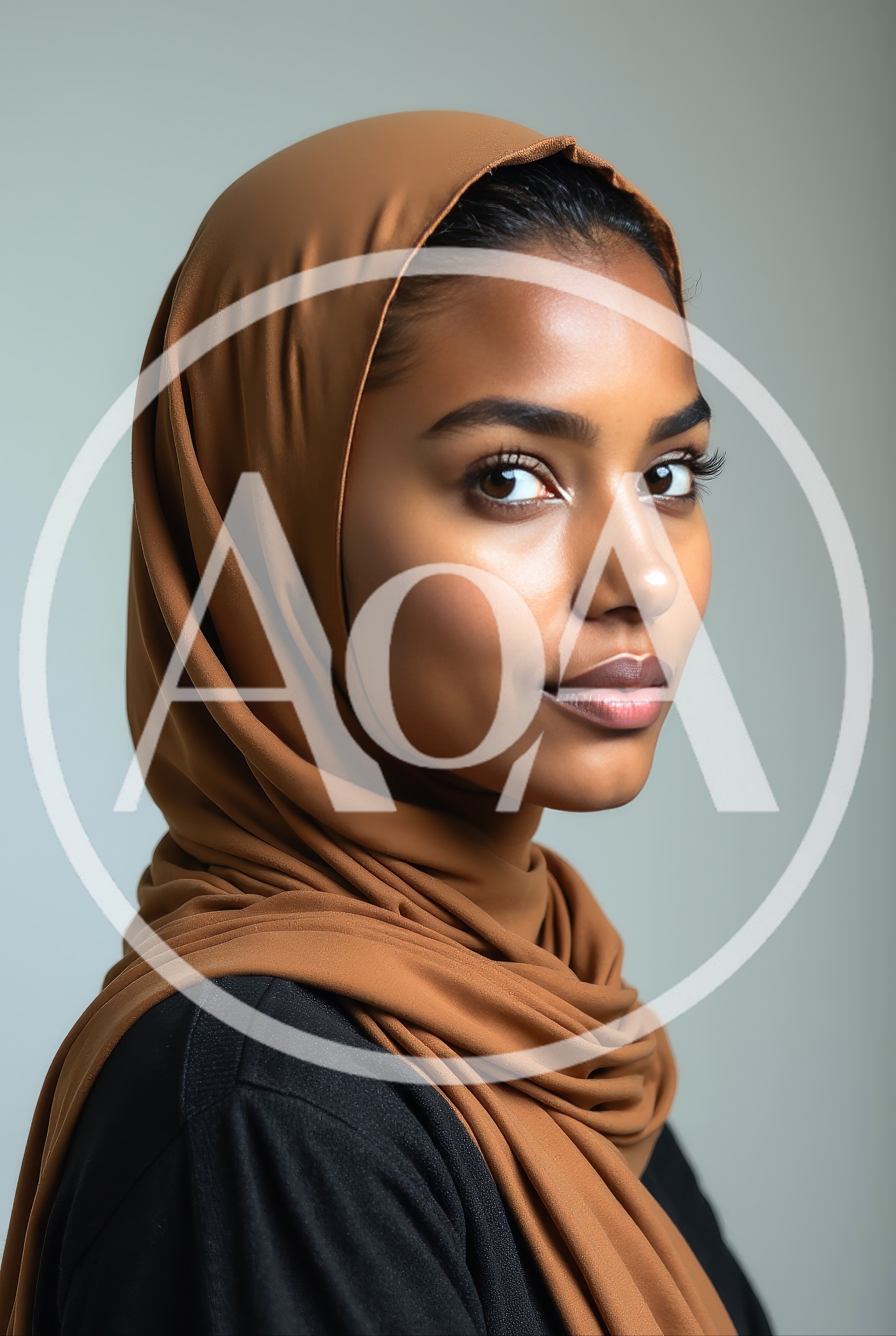 Portrait Of A Young Woman Wearing A Brown Hijab