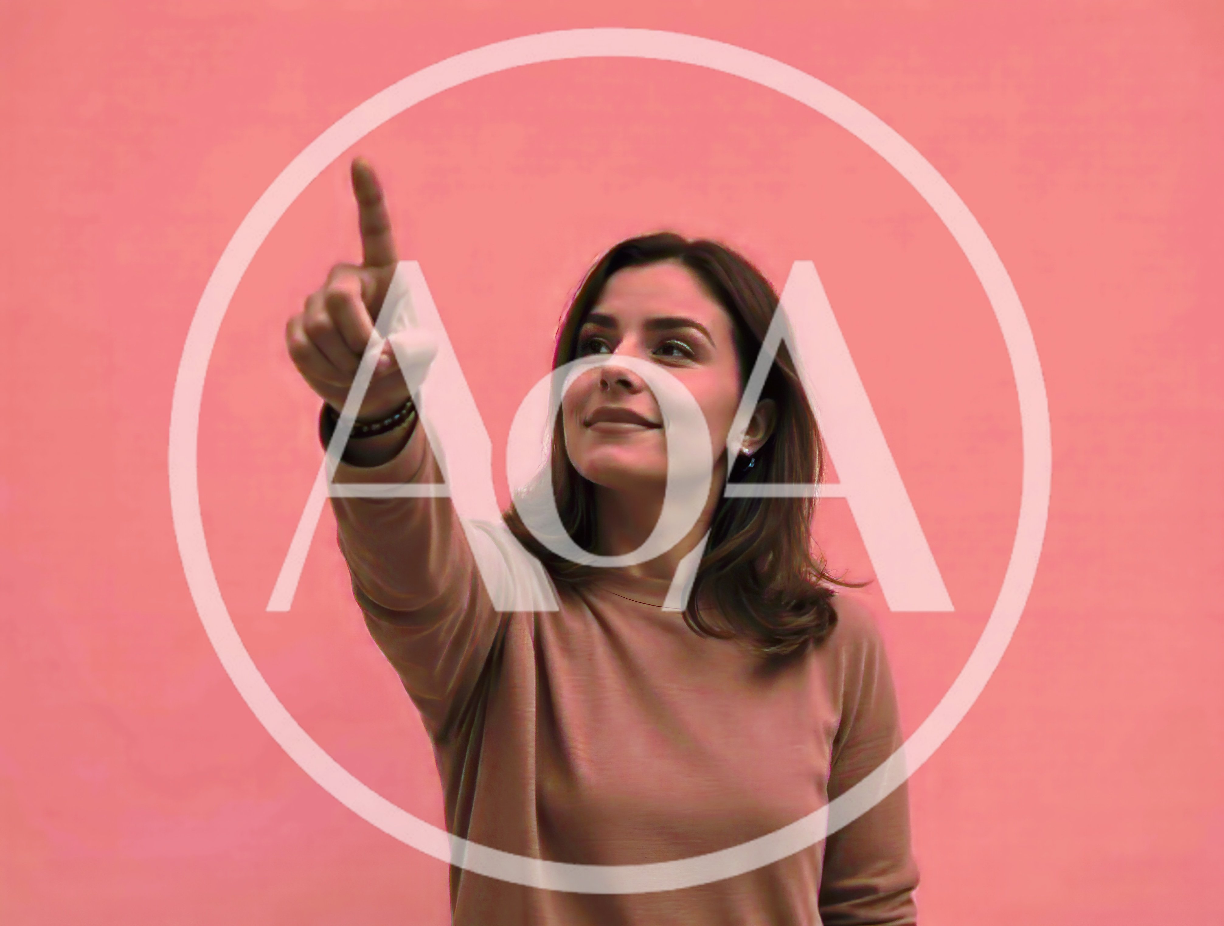 Young Woman Pointing Upwards Against Pink Background