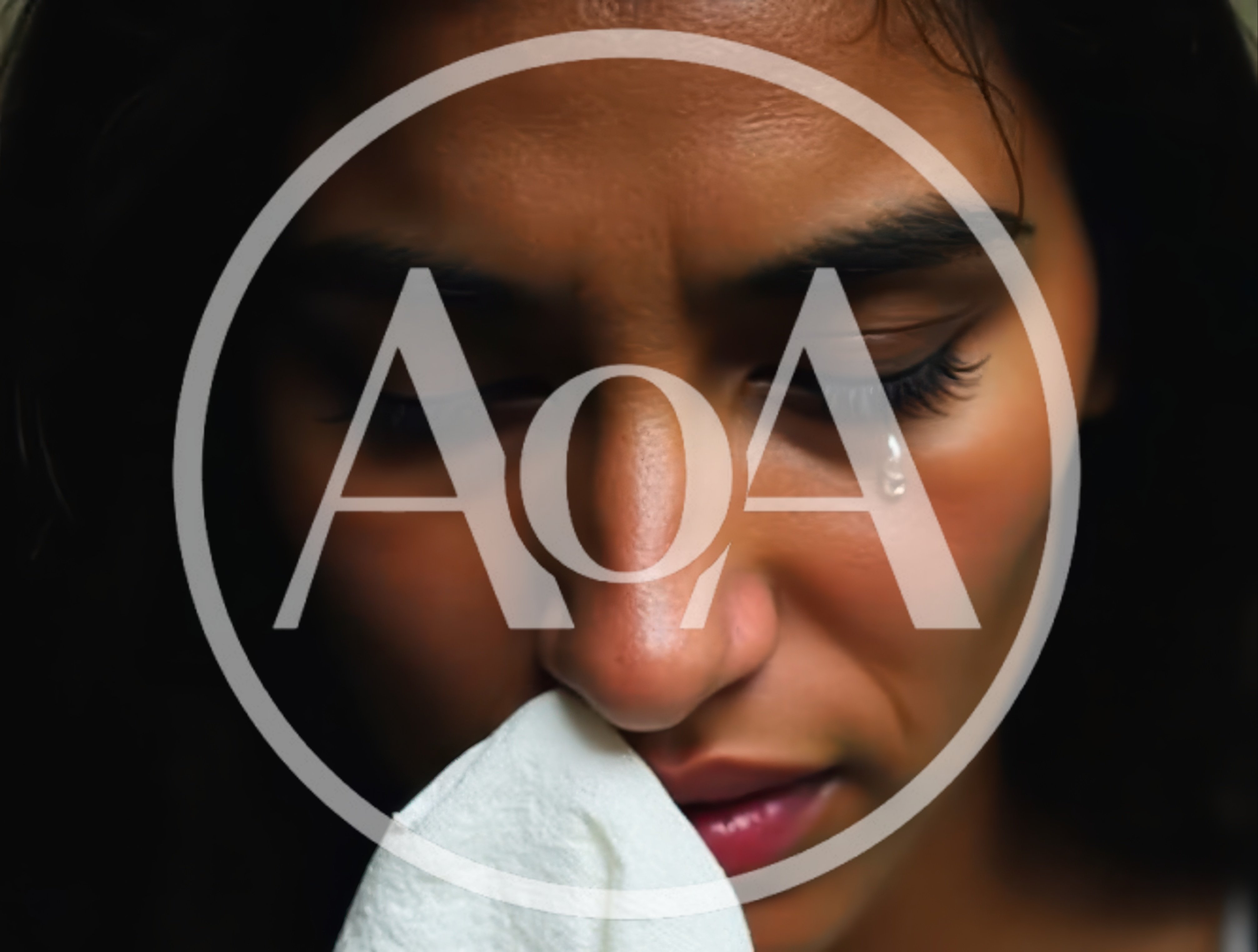 Close Up Of A Crying Woman Holding A Tissue