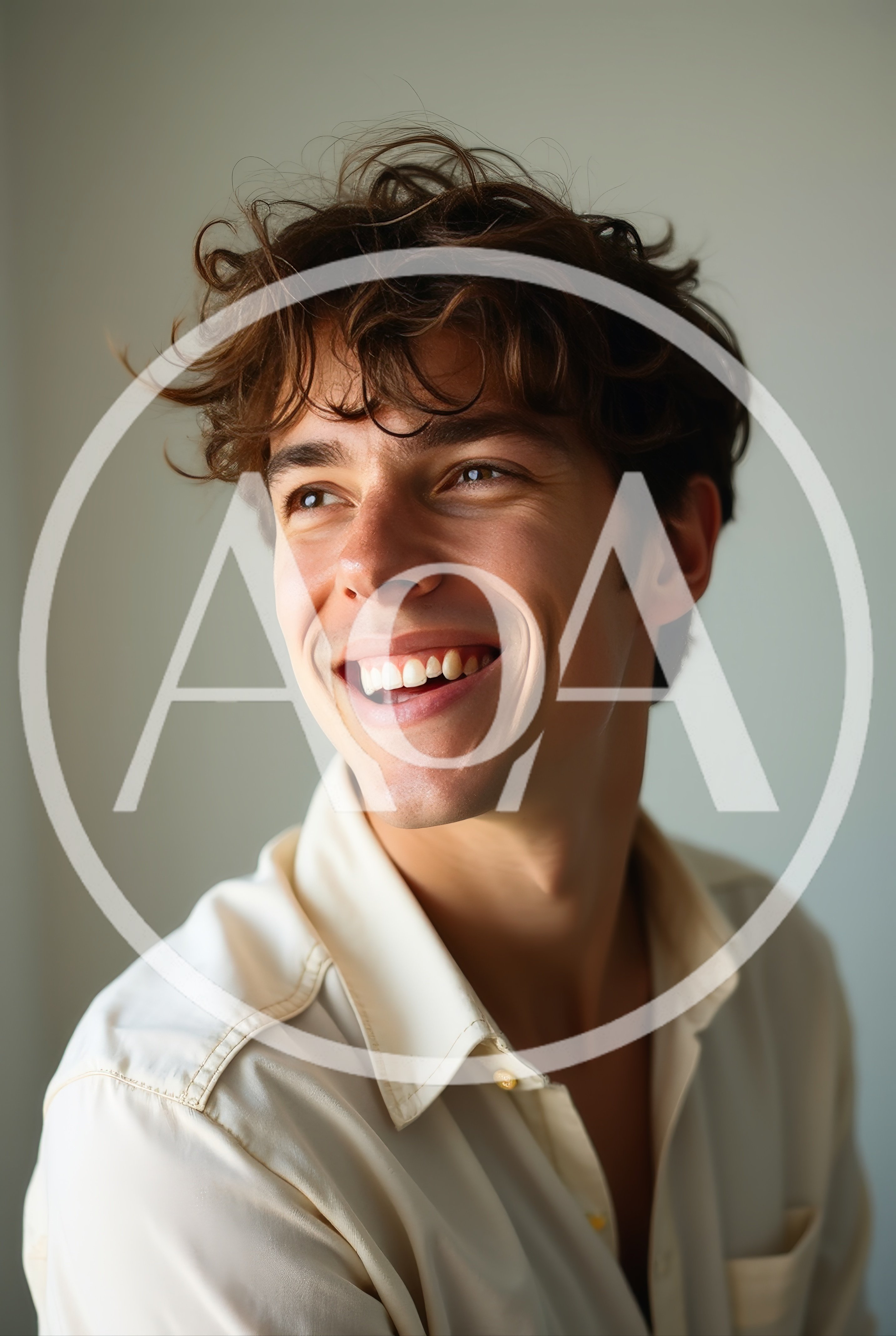 Portrait Of A Smiling Young Man With Messy Hair