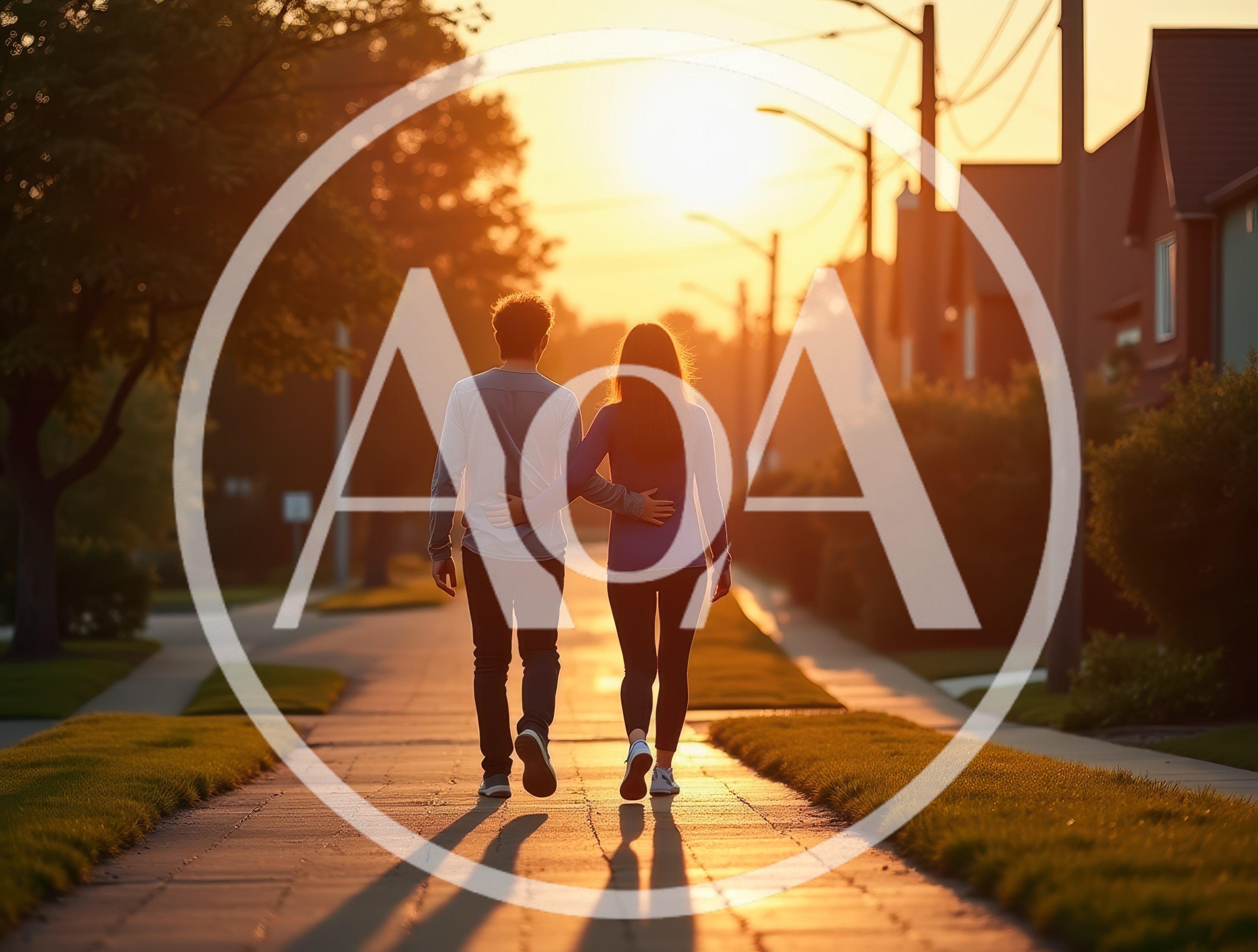 Couple Walking Together Down A Suburban Street At Sunset