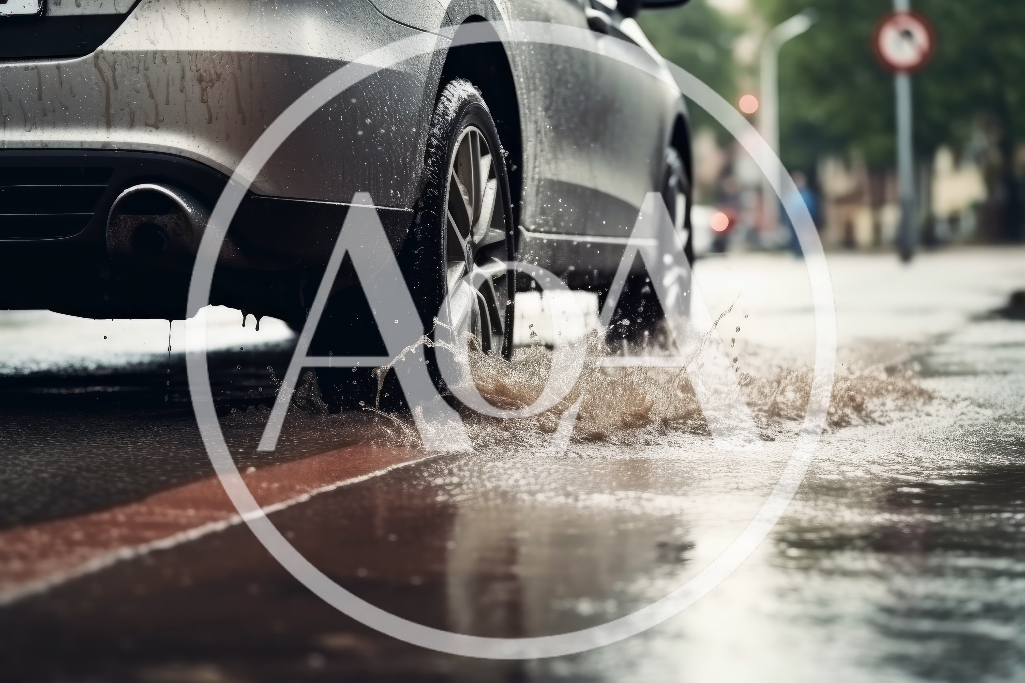 Car Driving Through A Puddle On A Rainy Day