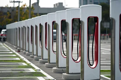 Row of Tesla Supercharger Stations in Parking Lot
