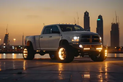 Modified White Pickup Truck Parked At Sunset