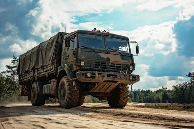 Military Cargo Truck Driving on Sandy Off-Road Terrain