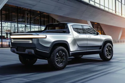 Modern Electric Pickup Truck Parked Outside Contemporary Building